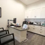 Treatment planning area with desk and two chairs for patients